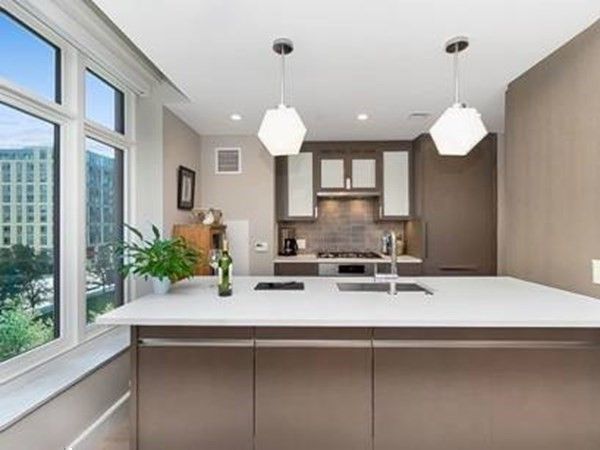 a kitchen with a sink and a chandelier