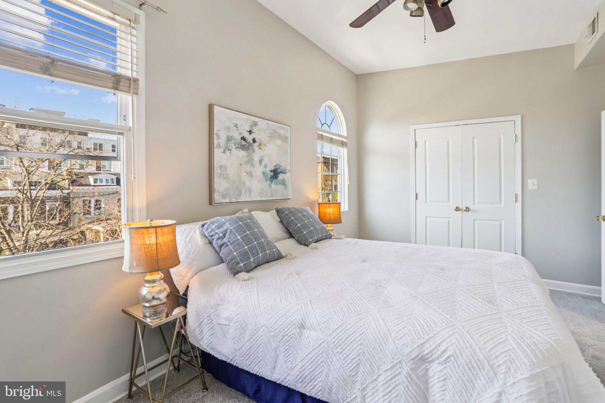 5501 8th Street Northwest, Unit 4 Washington, DC 20011 - Photo 11 of 38 a bedroom with a bed and a window