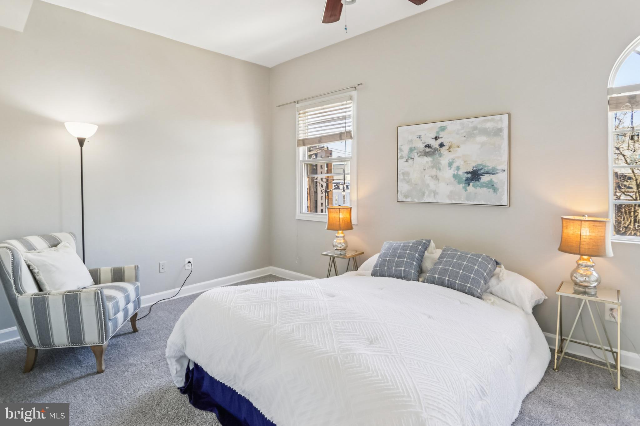 5501 8th Street Northwest, Unit 4 Washington, DC 20011 - Photo 13 of 38 a bedroom with a bed and a painting on the wall