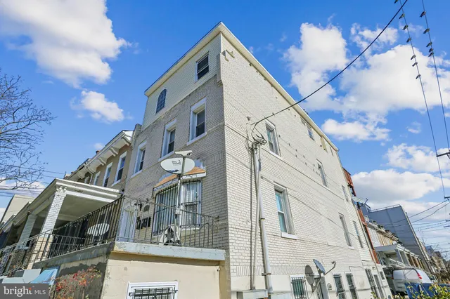 a view of a building with a street