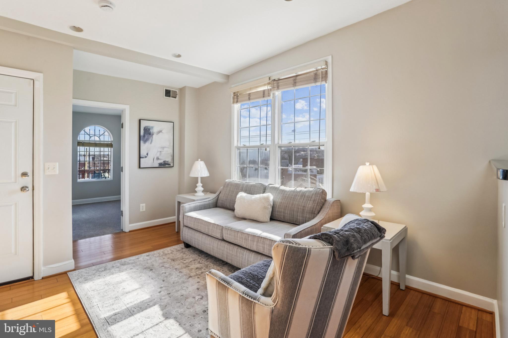 5501 8th Street Northwest, Unit 4 Washington, DC 20011 - Photo 2 of 38 a living room with furniture and a window
