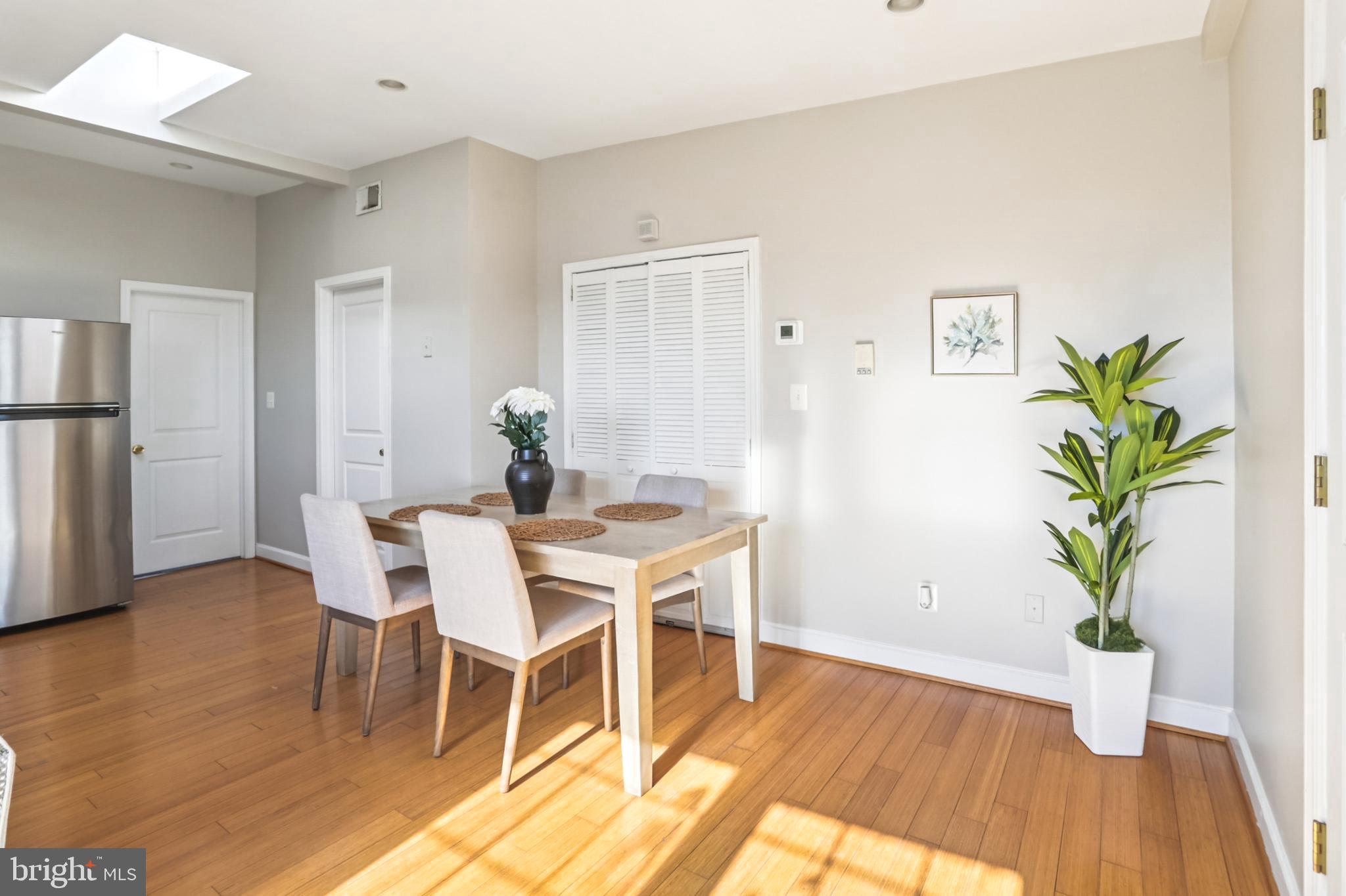 5501 8th Street Northwest, Unit 4 Washington, DC 20011 - Photo 6 of 38 a view of a dining room with furniture and wooden floor