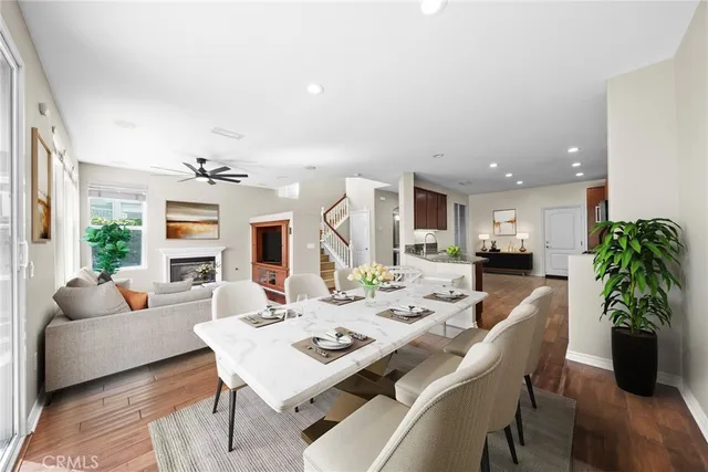 a kitchen with granite countertop a stove a sink and a microwave