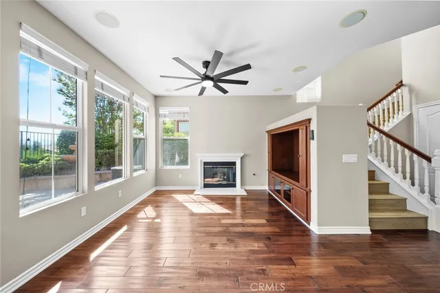 a kitchen with stainless steel appliances a refrigerator sink and wooden cabinets