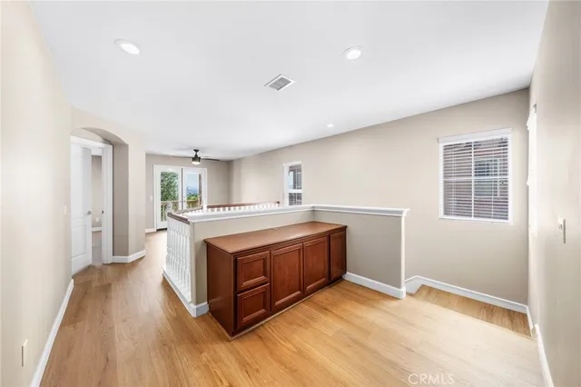 a bed room with a bed a couch and a window