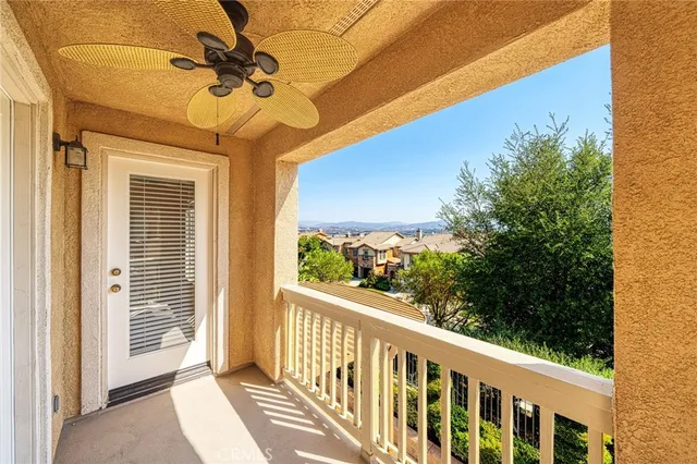 a view of a room with wooden floor and windows