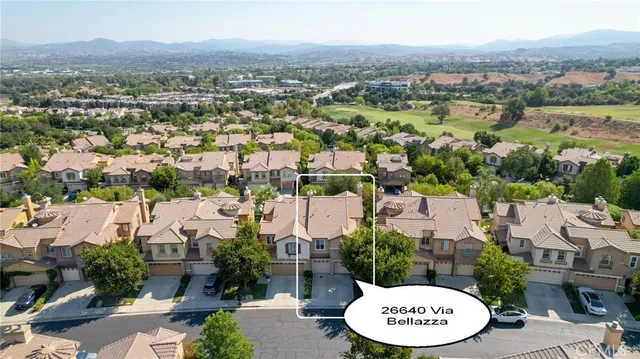 an aerial view of a house with a lake view