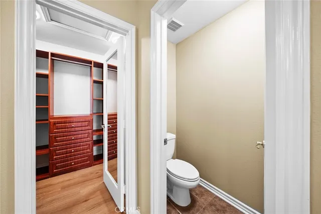 a couple of cars parked in front of a building