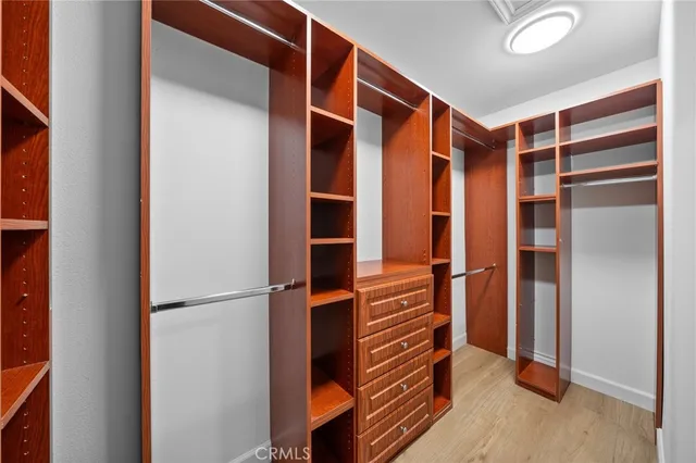 a yard with lots of green space and trees in the background