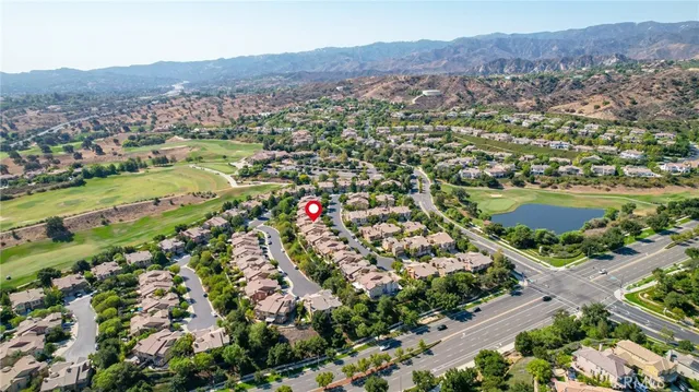 an aerial view of residential houses and city view
