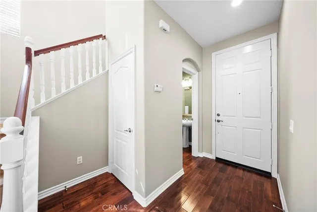 a view of entryway with wooden floor