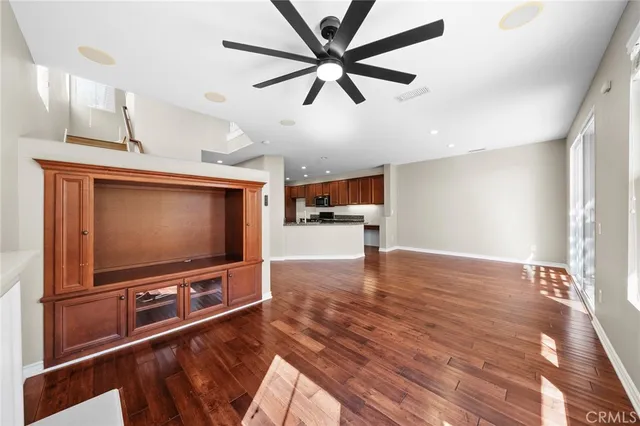 a view of a living room and wooden floor