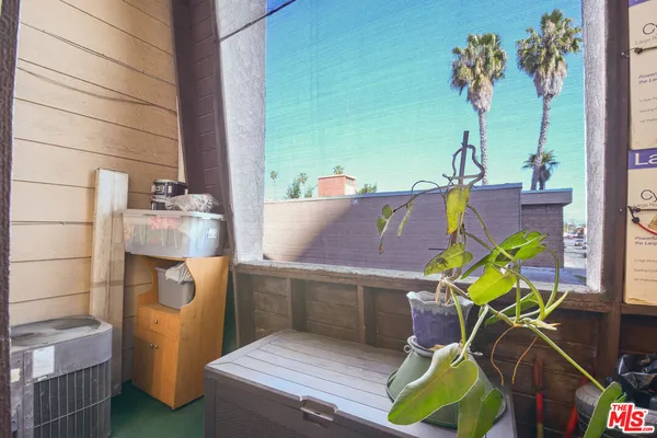 a workspace with furniture and a potted plant