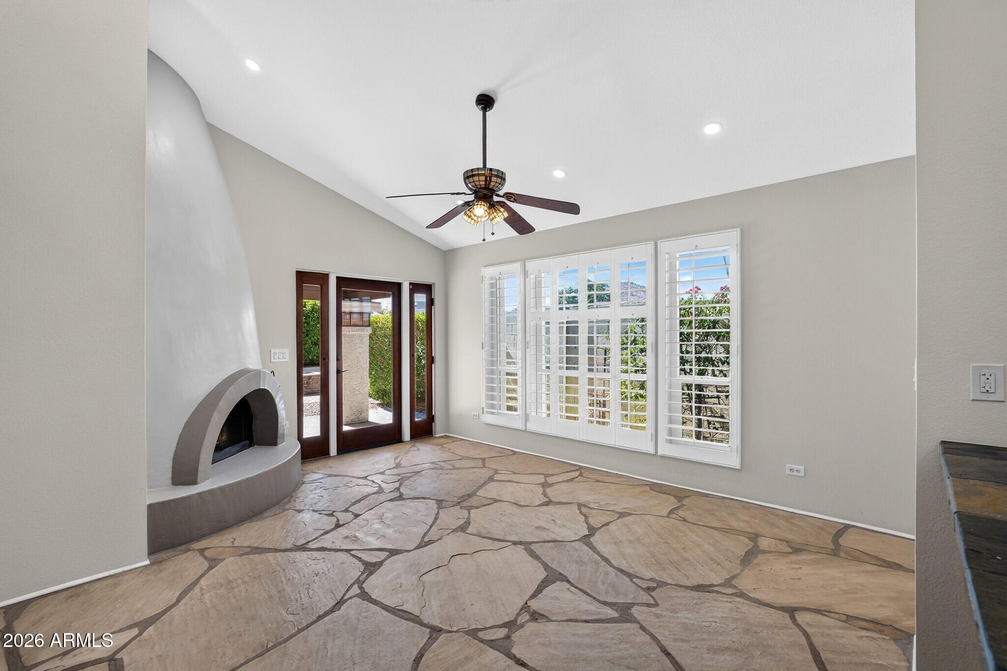 4615 East Monte Way Phoenix, AZ 85044 - Photo 28 of 35 a view of a livingroom with a ceiling fan and window