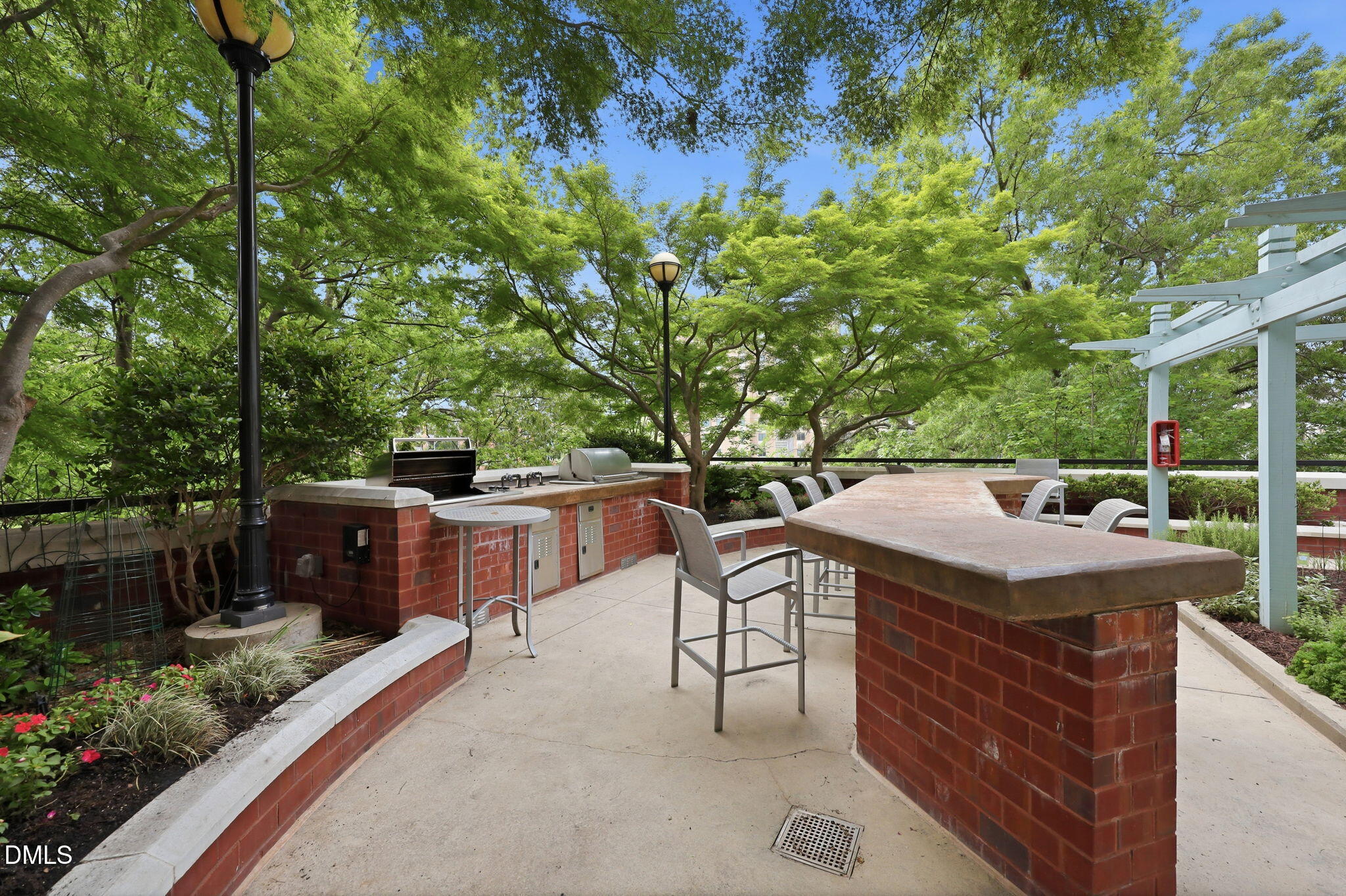 618 North Boylan Avenue, Unit 718 Raleigh, NC 27603 - Photo 26 of 38 a view of a dinning table and chairs in patio