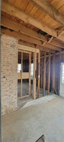 a view of a hallway with seating space