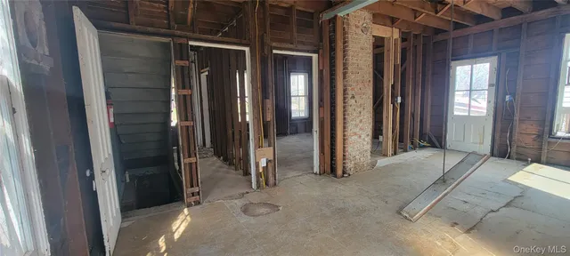 a view of a room with large windows