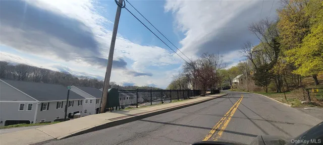 a view of balcony and car parked