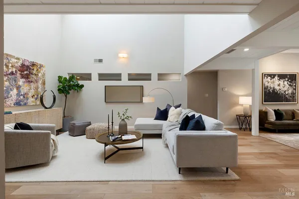 a living room with furniture or couch and a wooden floor