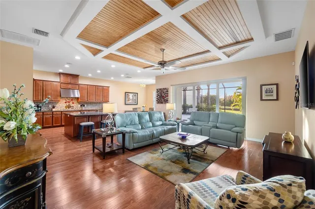 a dining room with furniture and wooden floor