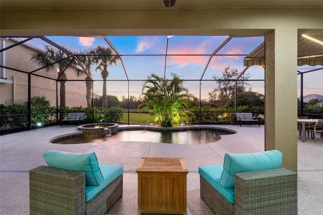 a view of a chairs and table in a patio