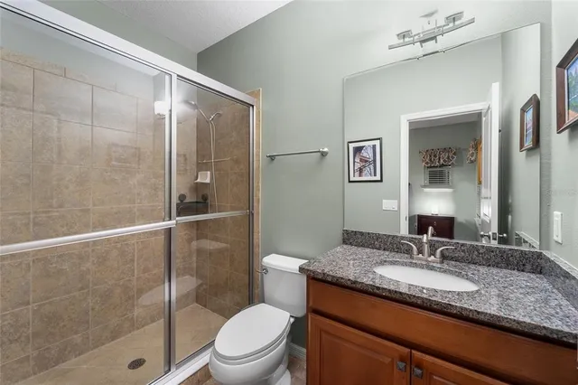 a room with gym equipment and a view of living room