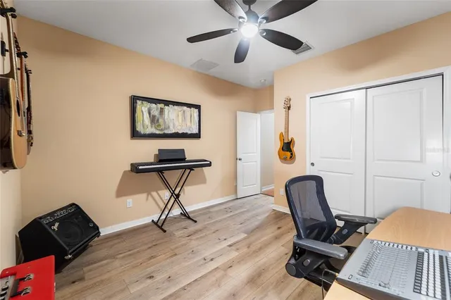 a view of a house with yard and sitting area