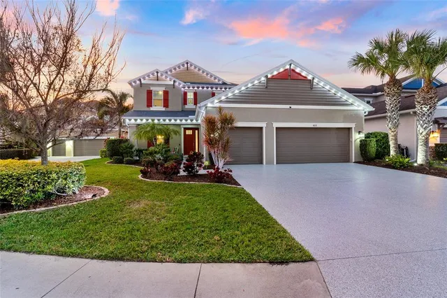 an aerial view of residential houses with swimming pool and lake view