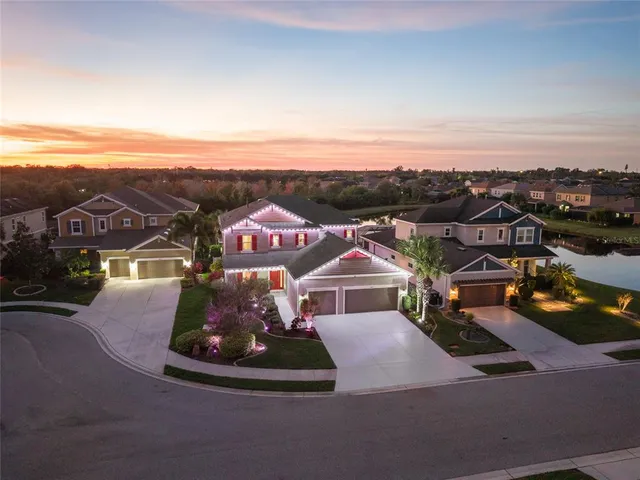 an aerial view of a house with outdoor space swimming pool and ocean view