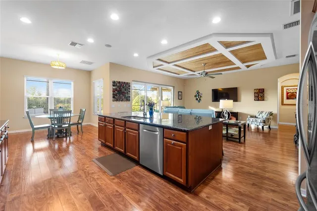 a kitchen with lots of counter top space and living room