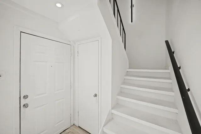 a view of staircase with white walls and white walls