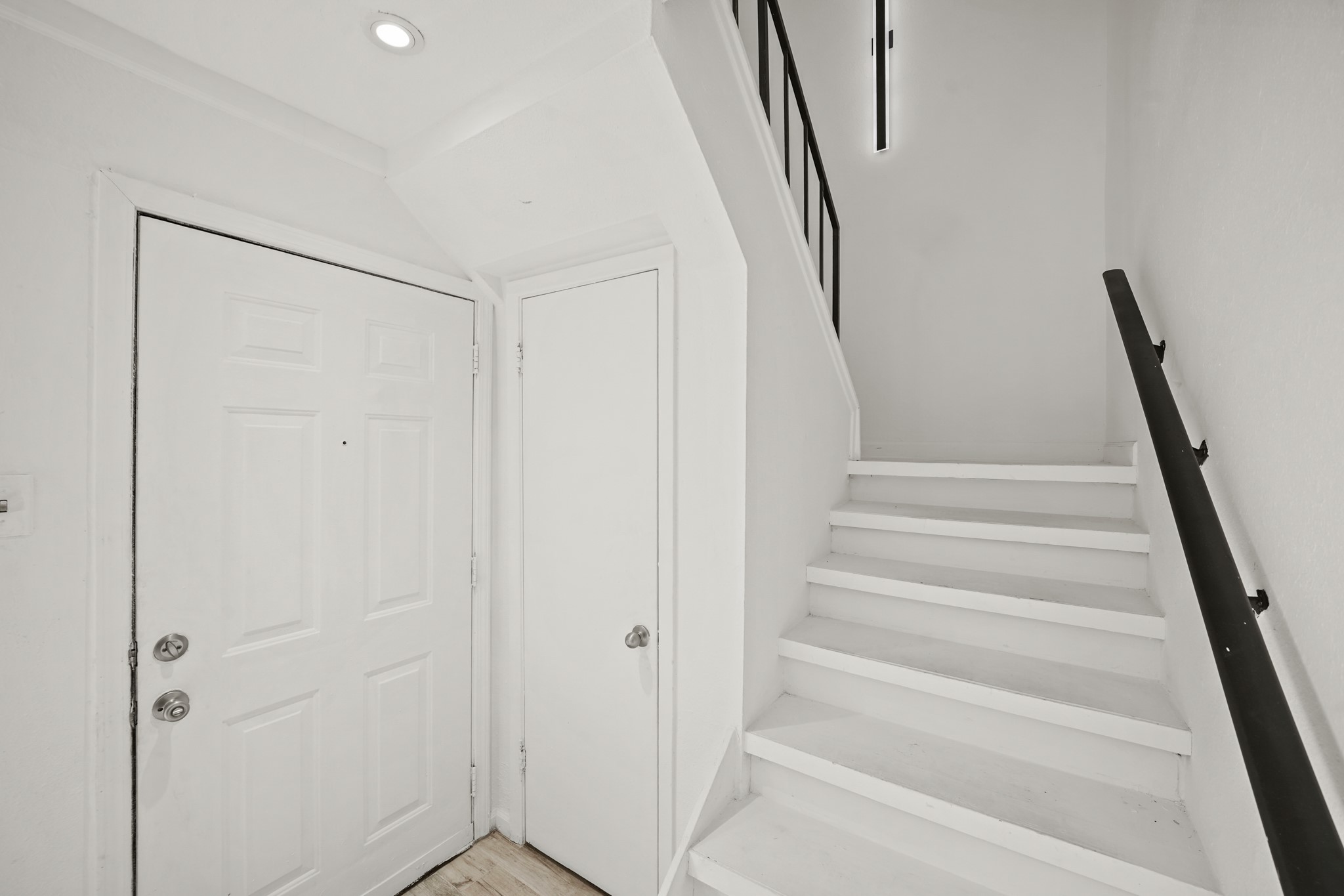 7047 Bissonnet Street, Unit 62 Houston, TX 77074 - Photo 2 of 15 a view of staircase with white walls and white walls