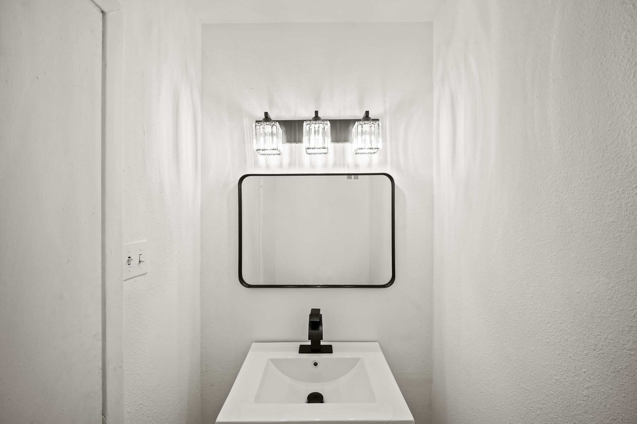 7047 Bissonnet Street, Unit 62 Houston, TX 77074 - Photo 6 of 15 a bathroom with a sink and a mirror