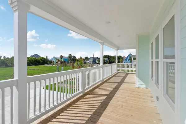 a view of balcony with wooden floor