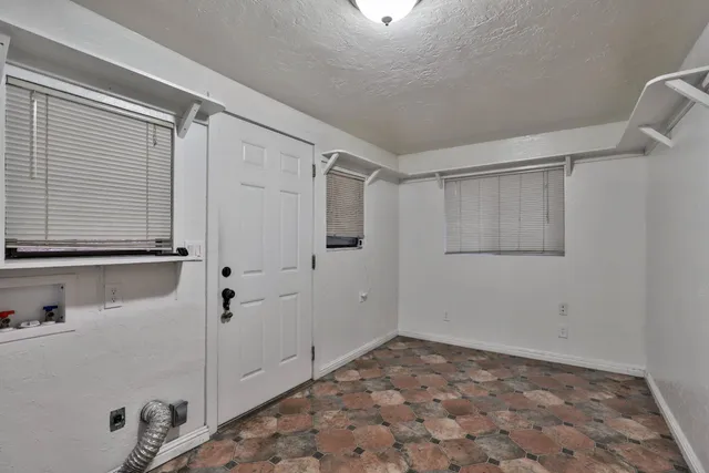 a bathroom with a shower and a sink
