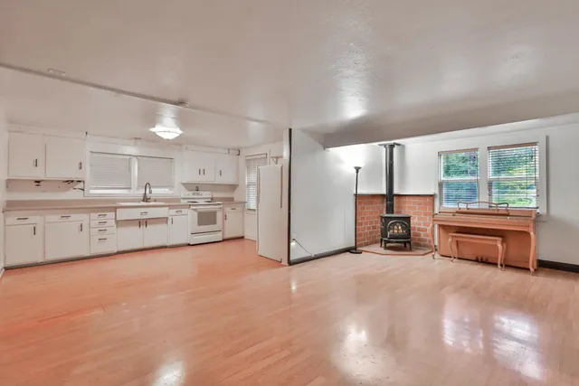 a view of a kitchen with furniture and a kitchen