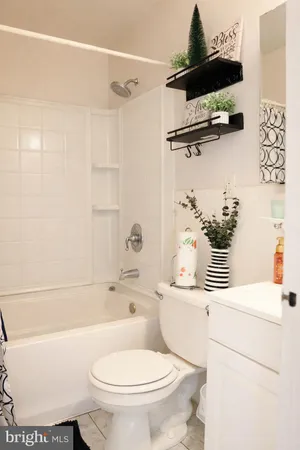 a bathroom with a sink a toilet and a bathtub