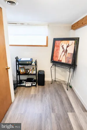 a view of workspace with furniture and window