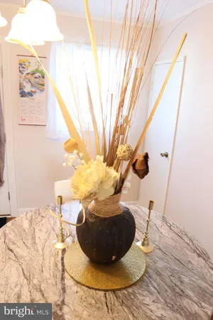 a vase of flowers sitting on a table