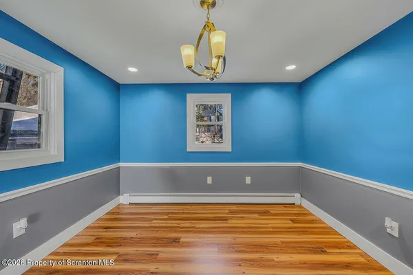 a view of a pool window and wooden floor
