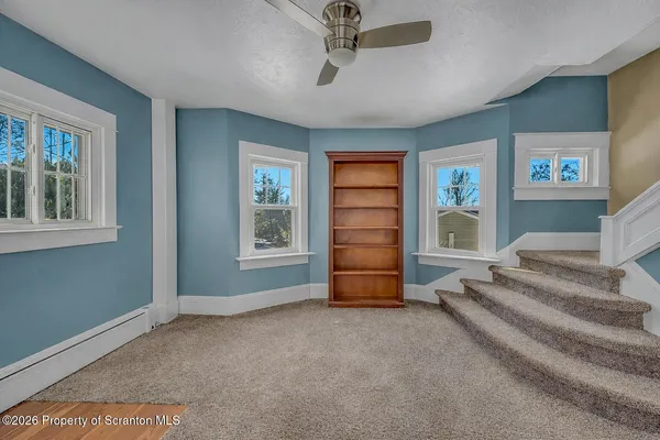 a view of an empty room with a window
