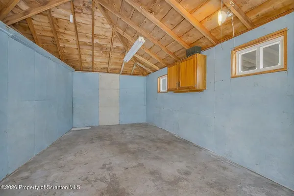 a view of a room with a wooden wall