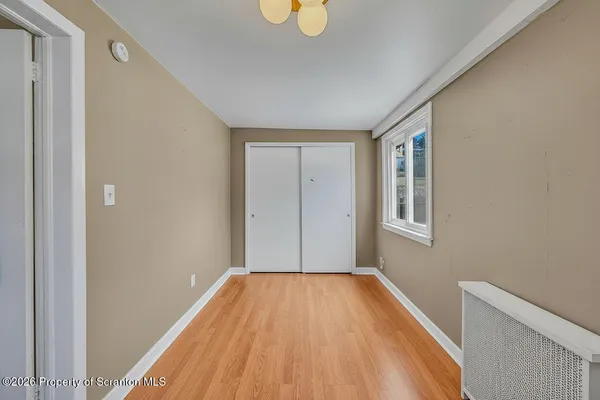 a view of livingroom with wooden floor and window