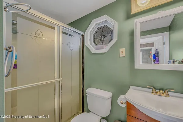 a bathroom with a toilet and a sink