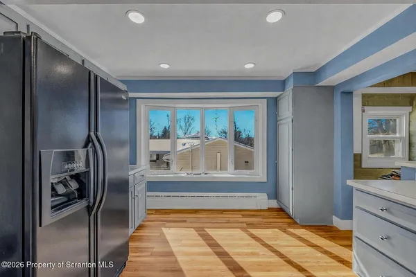 a view of entryway with kitchen