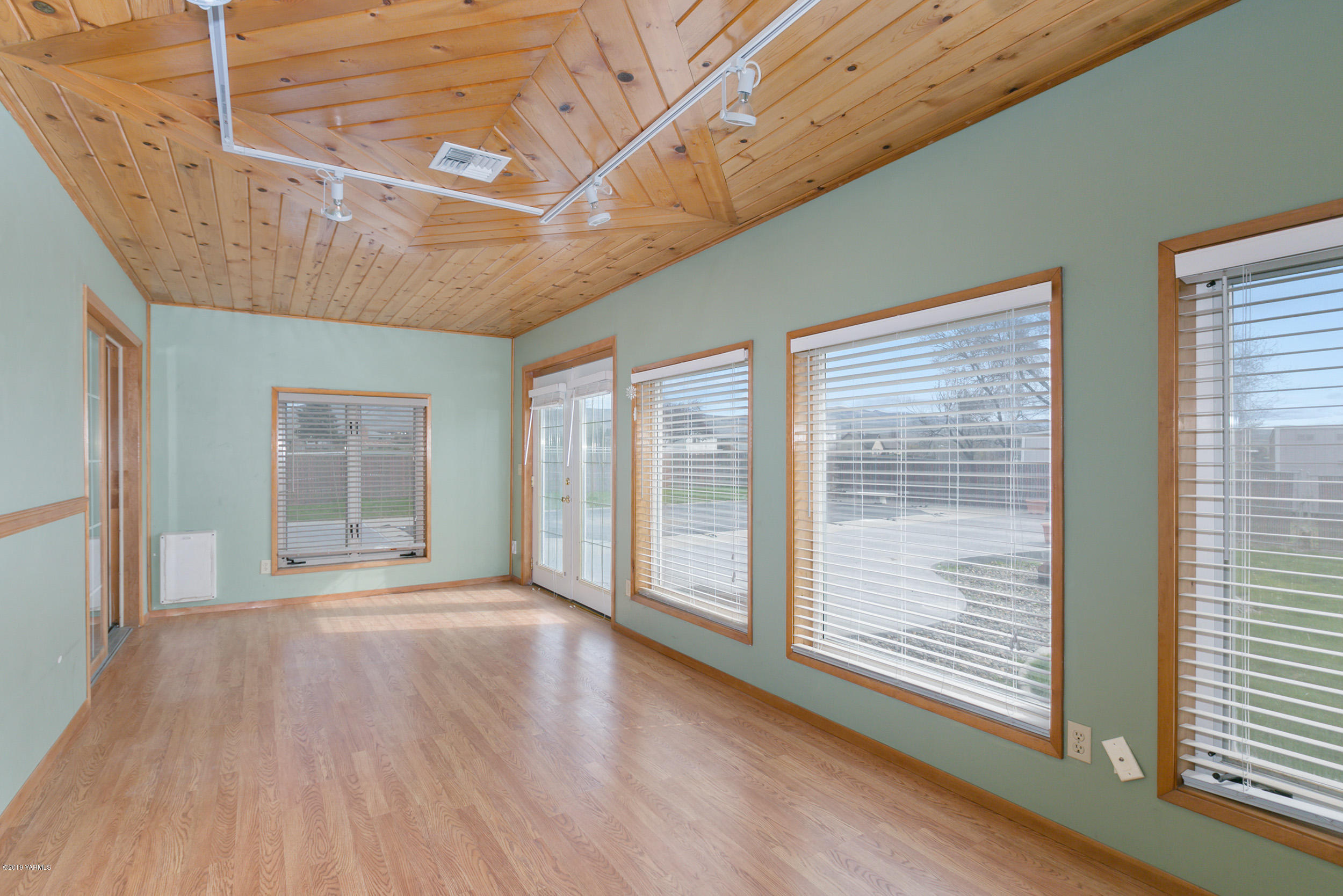 61 Faucher Road Yakima, WA 98901 - Photo 13 of 27 a view of an empty room with wooden floor and a window