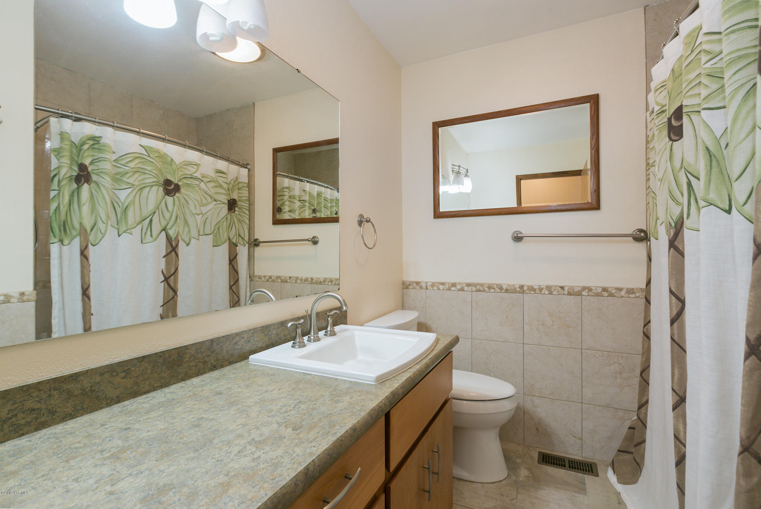 61 Faucher Road Yakima, WA 98901 - Photo 18 of 27 a bathroom with a granite countertop sink toilet and shower