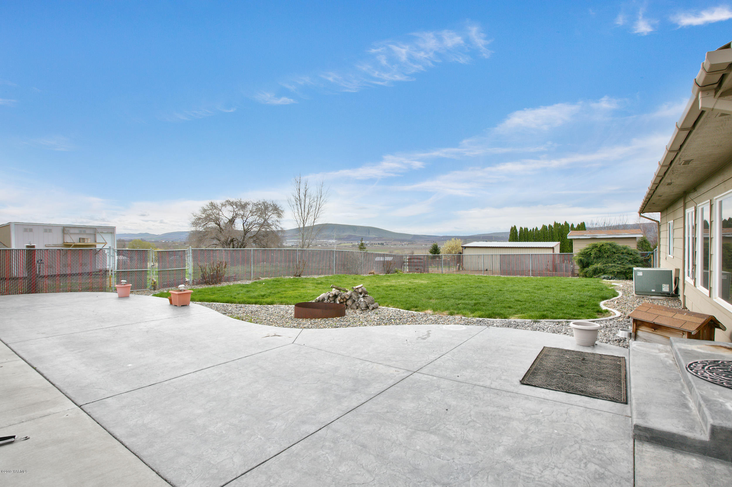 61 Faucher Road Yakima, WA 98901 - Photo 3 of 27 a view of a street with a road and a building in the background