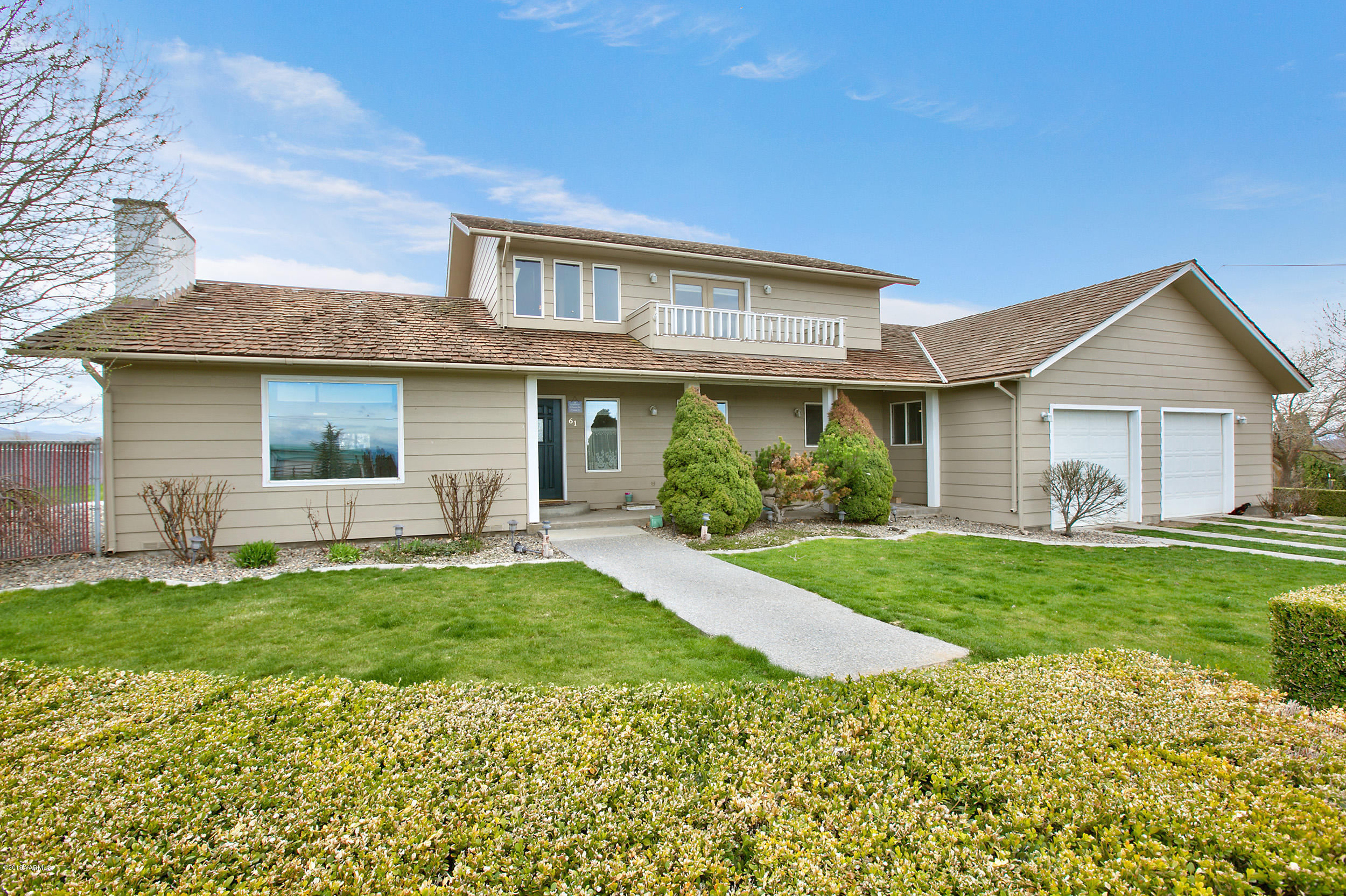 61 Faucher Road Yakima, WA 98901 - Photo 24 of 27 a front view of a house with a garden