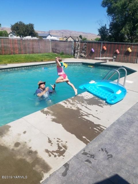 61 Faucher Road Yakima, WA 98901 - Photo 27 of 27 a view of swimming pool with a yard and seating area